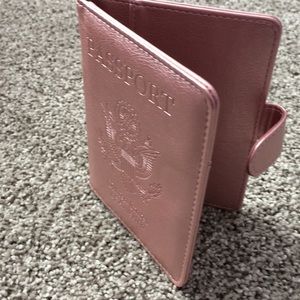 NWT leather passport holder in rose gold.